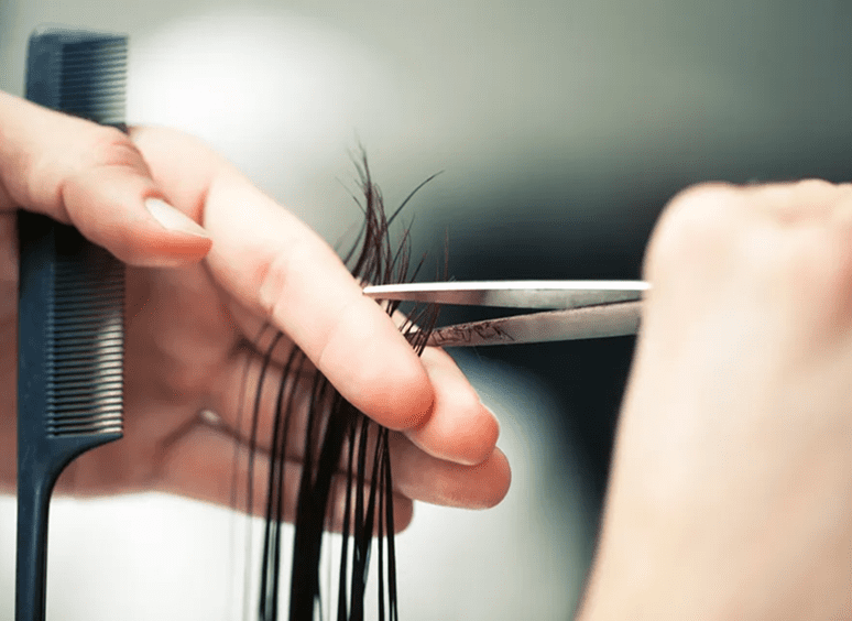 Haircut with scissors and comb