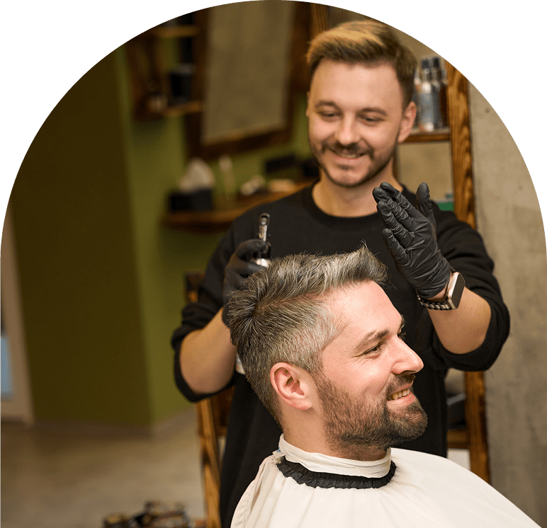 Man getting a haircut at a barbershop.