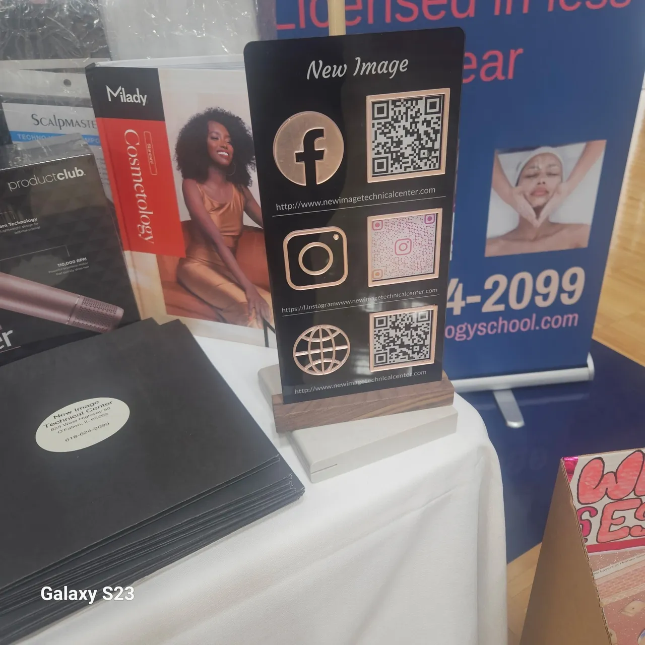 Social media QR codes on display stand