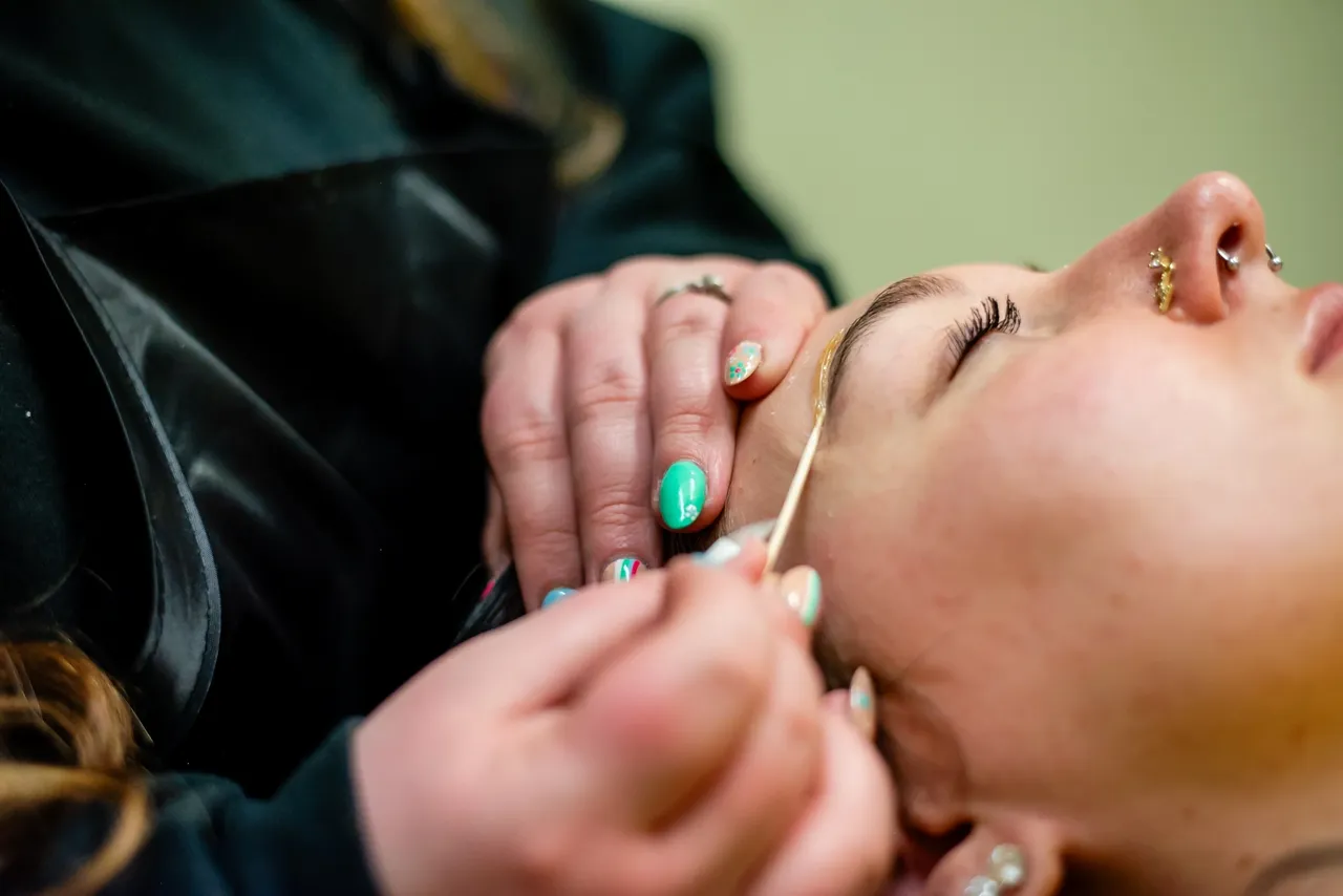 Eyebrow threading in progress