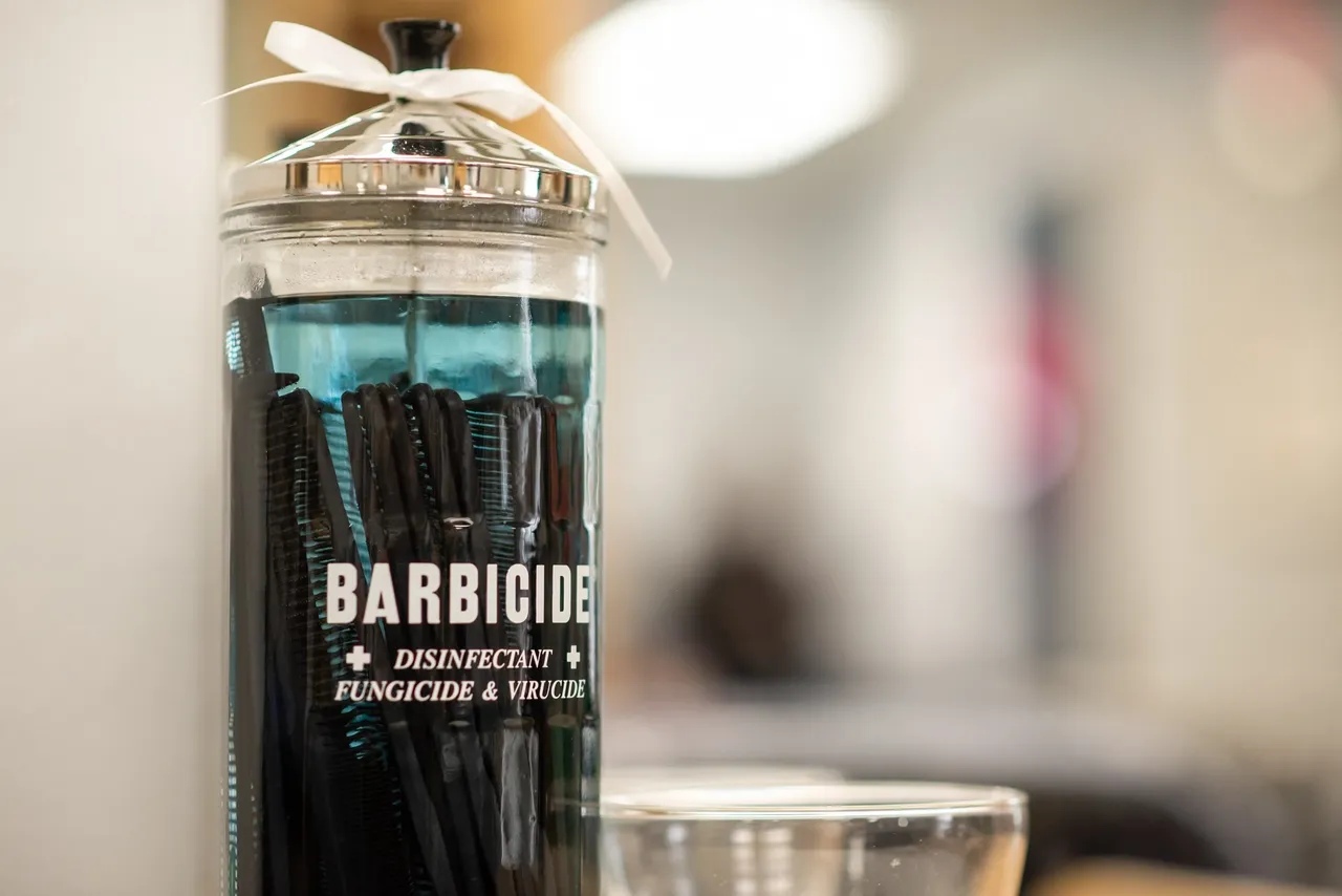Barbicide solution holding black combs