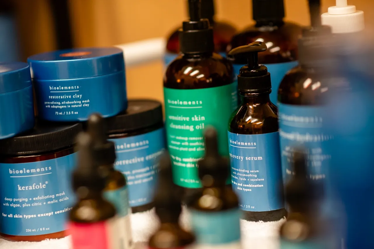 Skincare products in various bottles and jars.