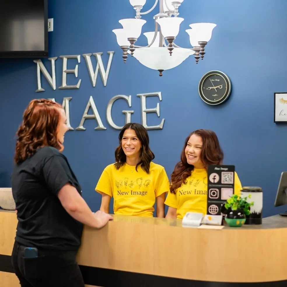 Two women at a reception desk