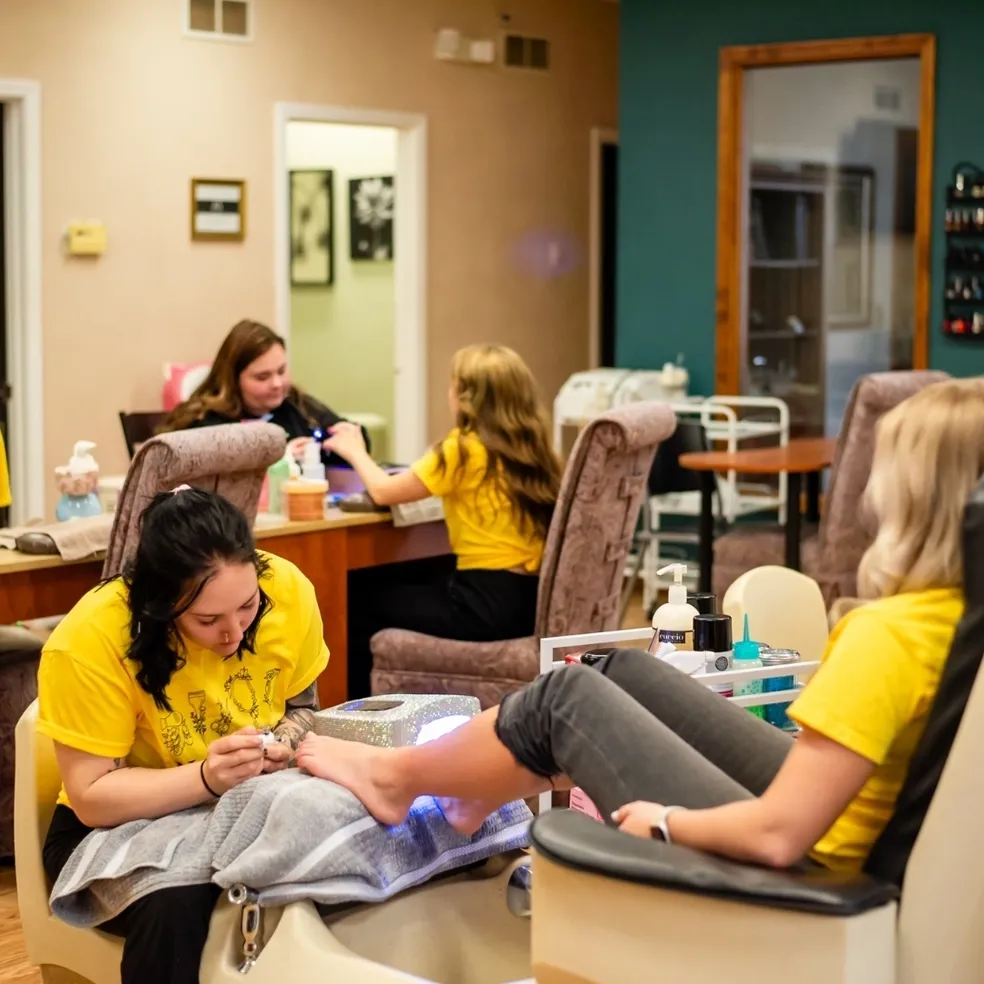 Women receiving nail care